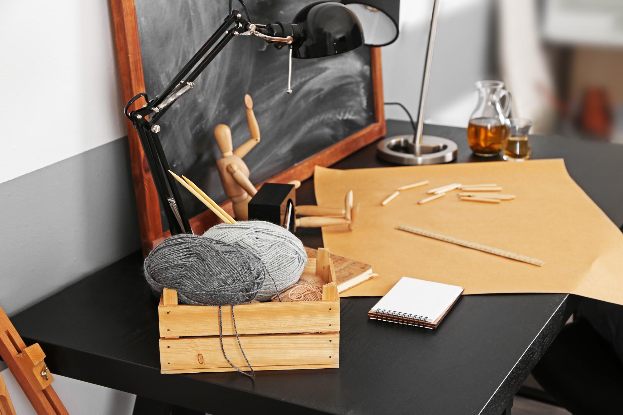 Studio workspace with threads and hoops